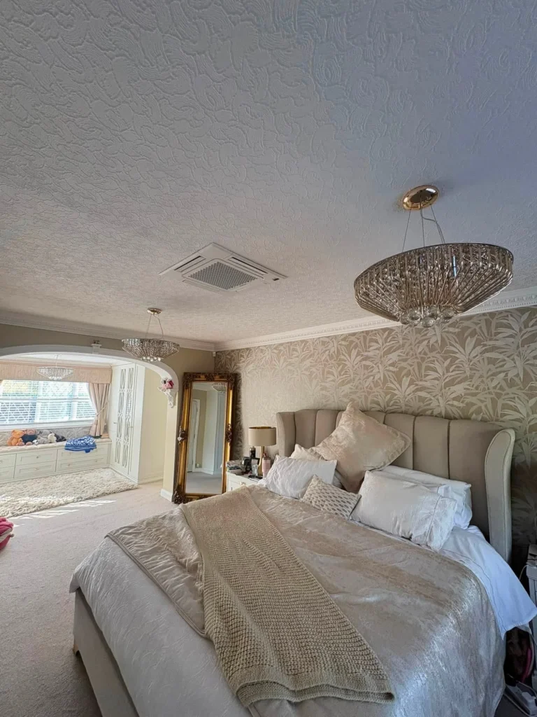 Ceiling cassette air conditioning installed discreetly in the bedroom ceiling of a Wordsley home