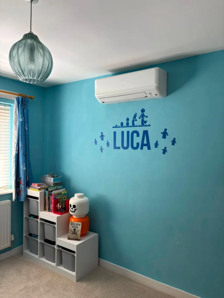 Wall-mounted air conditioning unit installed in a child's bedroom as part of a Dudley multi-split system
