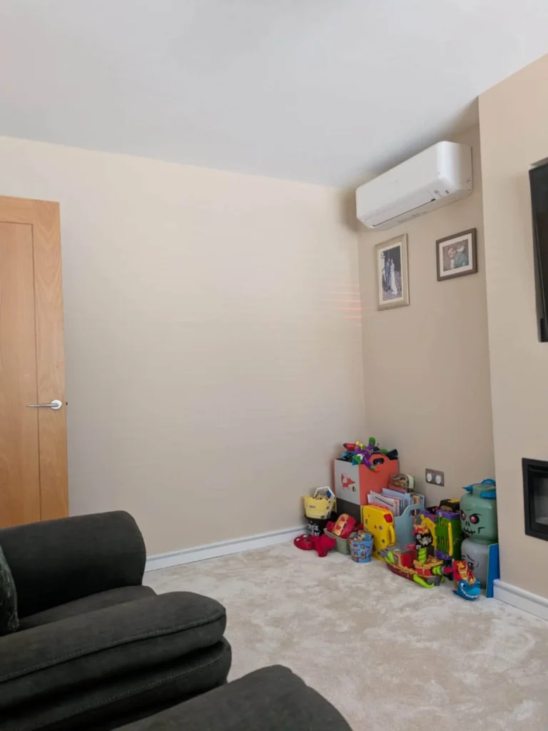 Wall-mounted home air conditioning unit installed in a living space in Dudley