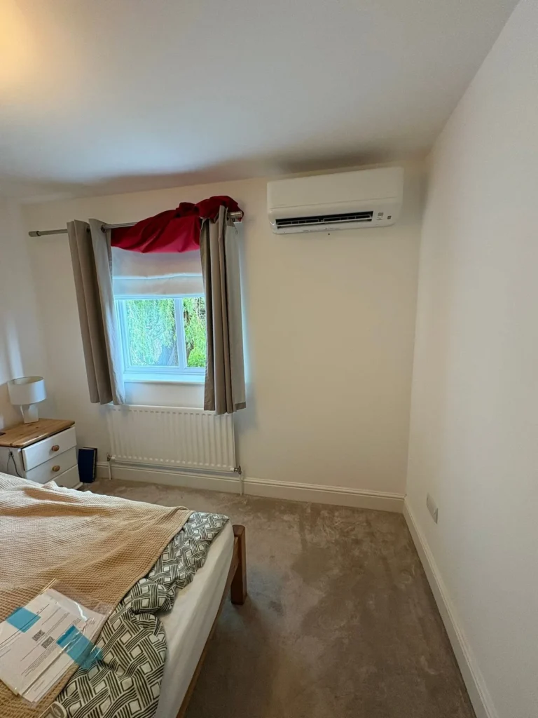 Finished Mitsubishi wall mounted air conditioning installation in a Warwick bedroom