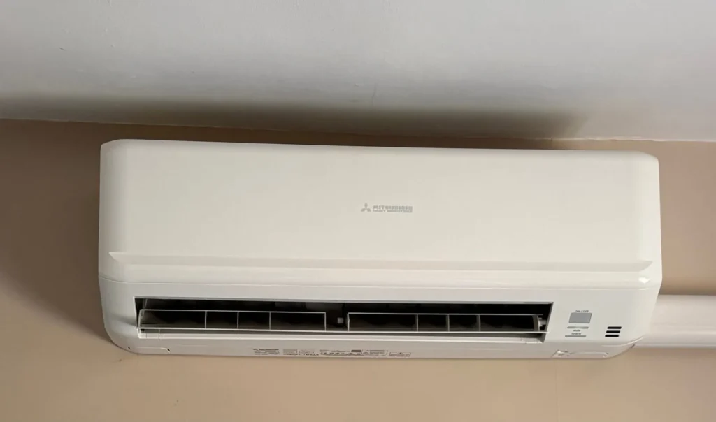 Mitsubishi wall-mounted air conditioning unit installed for bedroom cooling in a Cookley home