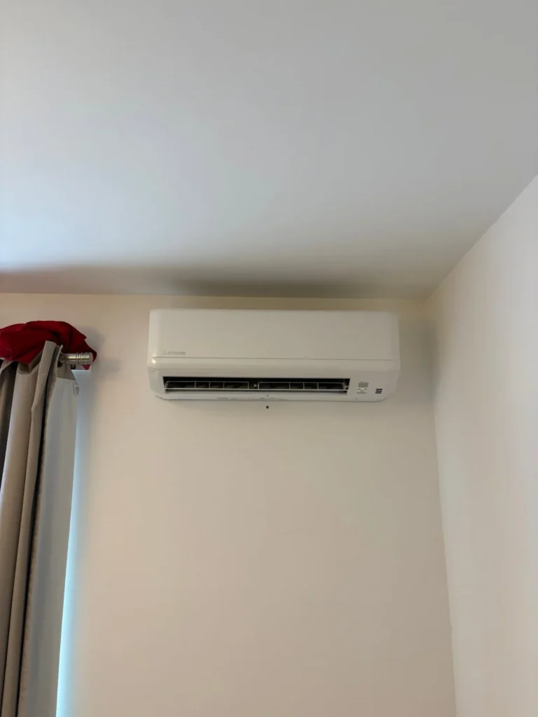 Mitsubishi wall mounted air conditioning unit installed in a Warwick bedroom